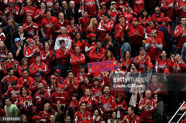 Fans cheer during Game Five of the Eastern Conference Quarterfinals of the 2011 NHL Stanley Cup Playoffs between the Washington Capitals and the New...