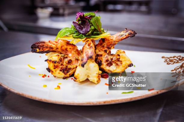 fine dining - char grilled tiger prawns served on a plate - gourmet stock pictures, royalty-free photos & images