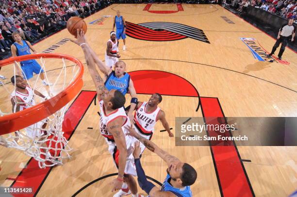 Jason Kidd of the Dallas Mavericks shoots against Marcus Camby of the Portland Trail Blazers in Game Four of the Western Conference Quarterfinals in...