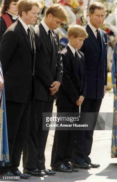 Earl Spencer, Prince William, Prince Harry and Prince Charles, Prince of Wales follow the coffin to the funeral of Diana, Princess of Wales on...