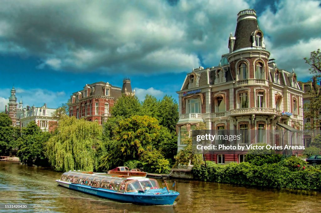 Tourist boat on a canal in Amsterdam, Netherlands