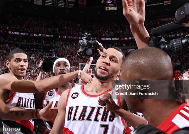 Brandon Roy of the Portland Trail Blazers is congratulated by teammates after Game Four of the Western Conference Quarterfinals against the Dallas...