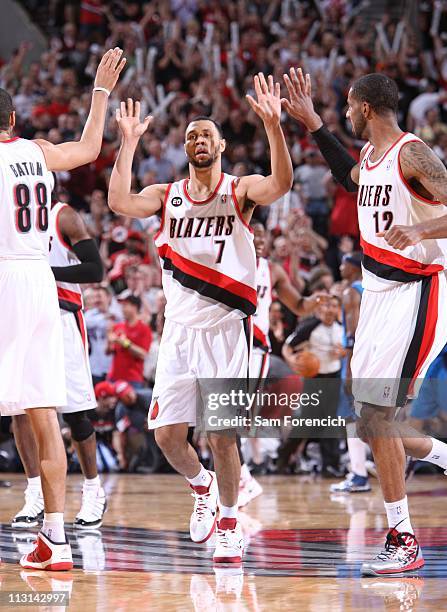 Brandon Roy of the Portland Trail Blazers high fives with teammates in Game Four of the Western Conference Quarterfinals against the Dallas Mavericks...