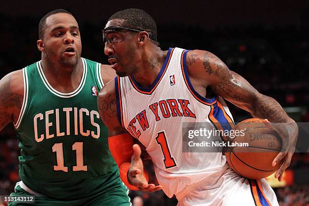 Amar'e Stoudemire of the New York Knicks drives against Glen Davis of the Boston Celtics in Game Four of the Eastern Conference Quarterfinals during...