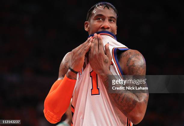 Amar'e Stoudemire of the New York Knicks wipes his face with his jersey in the first quarter against the Boston Celtics in Game Four of the Eastern...