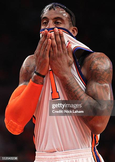 Amar'e Stoudemire of the New York Knicks wipes his face with his jersey in the first quarter against the Boston Celtics in Game Four of the Eastern...