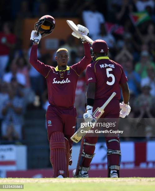 Shimron Hetmyer of the West Indies celebrates with Ashley Nurse after reaching his century during the 2nd One Day International match between the...