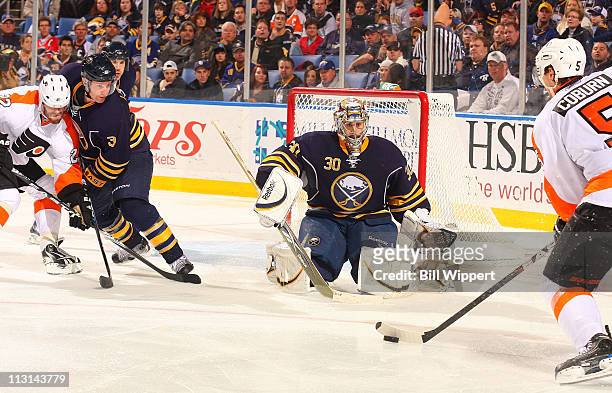 Ryan Miller of the Buffalo Sabres braces for a shot from Braydon Coburn of the Philadelphia Flyers in Game Four of the Eastern Conference...