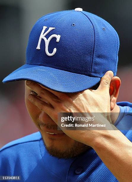 Pitcher Bruce Chen of the Kansas City Royals wipes his face as he is relieved against the Texas Rangers in the 6th inning at Rangers Ballpark in...