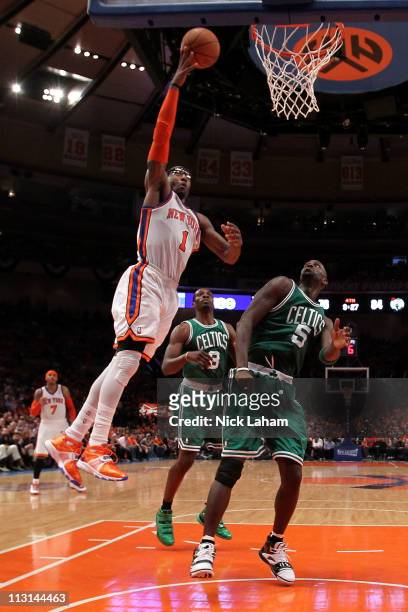 Amar'e Stoudemire of the New York Knicks attempts a shot against Kevin Garnett of the Boston Celtics in Game Four of the Eastern Conference...
