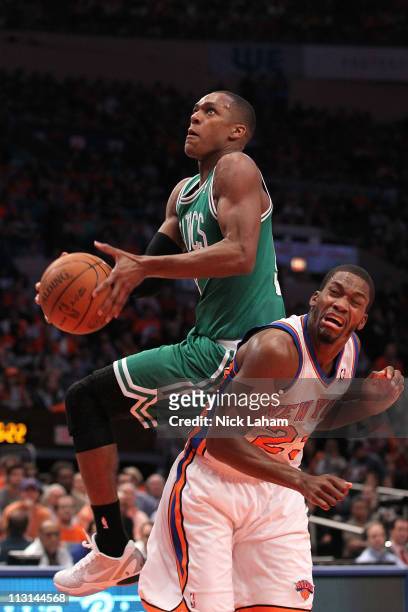 Rajon Rondo of the Boston Celtics drives for a shot attempt against Toney Douglas of the New York Knicks in Game Four of the Eastern Conference...