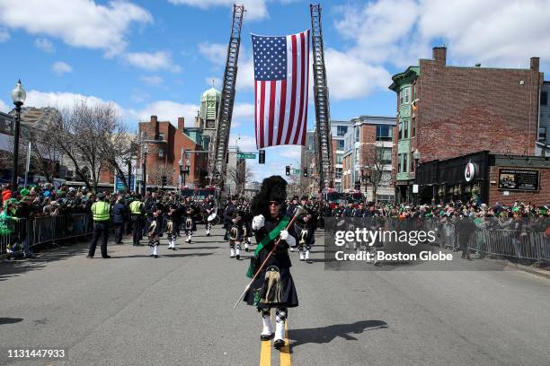 Pipes and drum band marches during the annual St. Patrick's Day parade in South Boston on March 17, 2019.