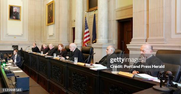 From left, Justices Jeffrey Hjelm, Ellen Gorman, Donald Alexander, Chief Justice Leigh Saufley, Andrew Mead, Joseph Jabar and Thomas Humphrey listen...