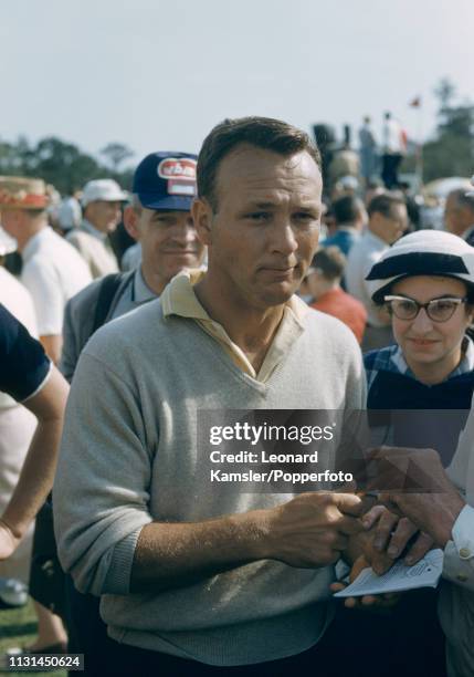 American golfer Arnold Palmer signing autographs during the US Masters Golf Tournament at the Augusta National Golf Club in Augusta, Georgia, circa...