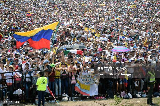 Fans wave a Venezuelan flag during the 'Venezuela Aid Live' at Unity Bridge on February 22, 2019 in Cucuta, Colombia. Richard Branson organized the...