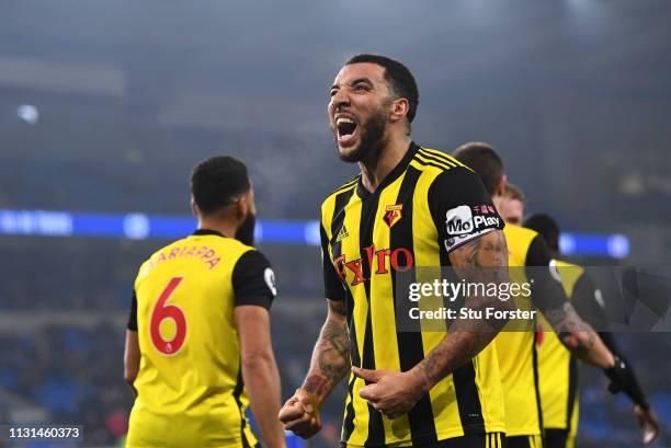 Troy Deeney of Watford celebrates as he scores his team's fifth goal during the Premier League match between Cardiff City and Watford FC at Cardiff...