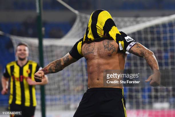 Troy Deeney of Watford celebrates as he scores his team's fifth goal during the Premier League match between Cardiff City and Watford FC at Cardiff...