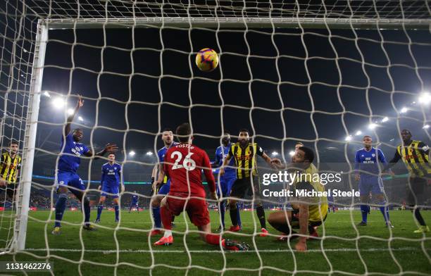 Sol Bamba of Cardiff City scores his team's first goal past Ben Foster of Watford during the Premier League match between Cardiff City and Watford FC...