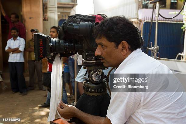 Camera operator works at Basra Studios in Mumbai, India, on Monday, April 18, 2011. India's film industry generated an estimated 107 billion rupees...