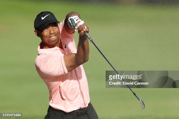 Tiger Woods of the United States plays his second shot on the ninth hole during the second round of World Golf Championships-Mexico Championship at...