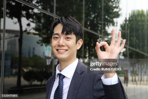 businessman showing ok sign - ok hand sign stock pictures, royalty-free photos & images