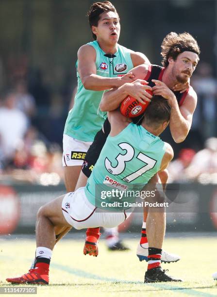 Dylan Roberton of the Saints is tackled by Bailey Rice of the Saints during the St Kilda pre-season club match at RSEA Park on February 23, 2019 in...