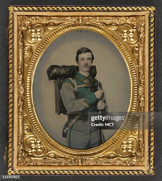 An unidentified Confederate soldier, of Company E, "Lynchburg Rifles," 11th Virginia Infantry Volunteers, appears with an 1841 "Mississippi" rifle,...