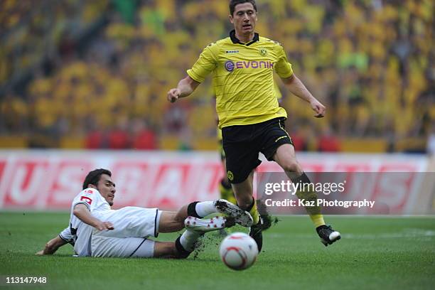 Robert Lewandowski of Dortmund passes the tackle of Juan Arango of BorussiaMG at Borussia Park Stadium on April 23, 2011 in moenchengladbach, Germany.