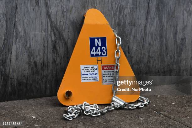 Wheel clamp device left on a side of the walking part in Dublin's city center. On Friday, March 15 in Dublin, Ireland.