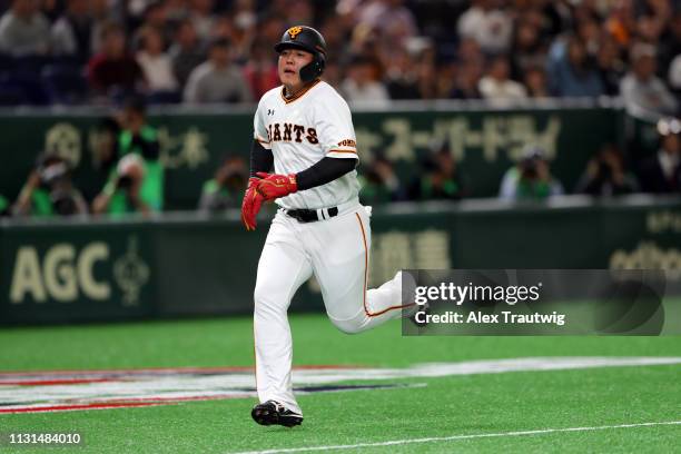 Kazuma Okamoto of the Yomiuri Giants scores a run during an exhibition game against the Seattle Mariners for the 2019 Opening Series at the Tokyo...