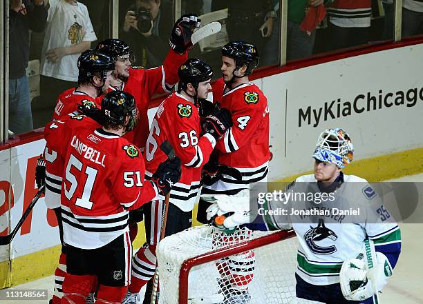Brian Campbell, Bryan Bickell, Michael Frolik, Dave Bolland and Niklas Hjalmarsson of the Chicago Blackhawks celebrate a 1st period goal against Cory...