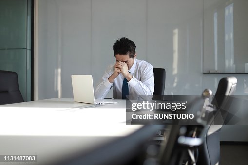 Stressed mature businessman with laptop Stressed mature businessman with laptop