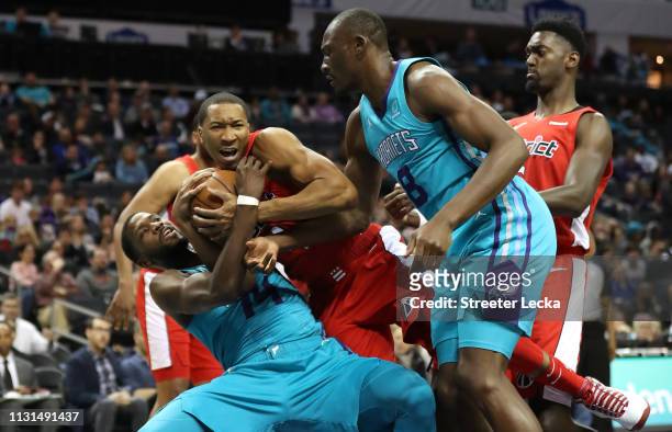 Wesley Johnson of the Washington Wizards battles for a loose ball against Michael Kidd-Gilchrist of the Charlotte Hornets during their game at...