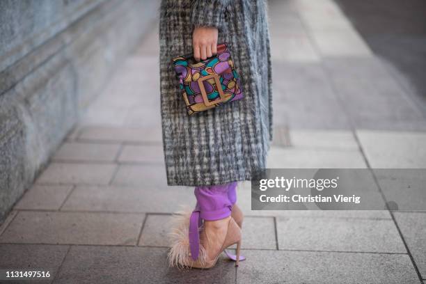 Sonia Lyson is seen wearing shoes Jimmy Choo, pink pants Attico, Alberta Ferretti jumper, Boyy bag, coat giadabenincasa on Day 3 Milan Fashion Week...