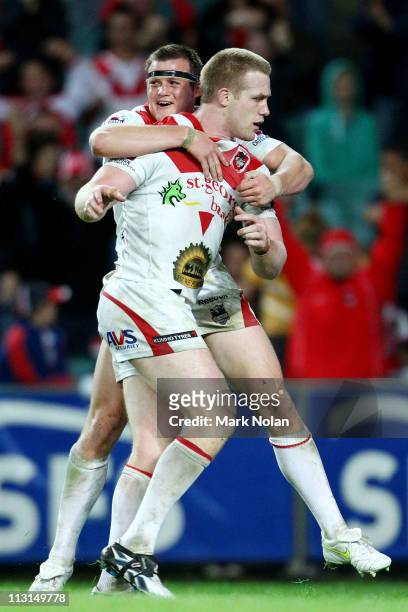 Brett Morris of the Dragons congratulates team mate Ben Creagh after he scored during the round seven NRL match between the Sydney Roosters and the...