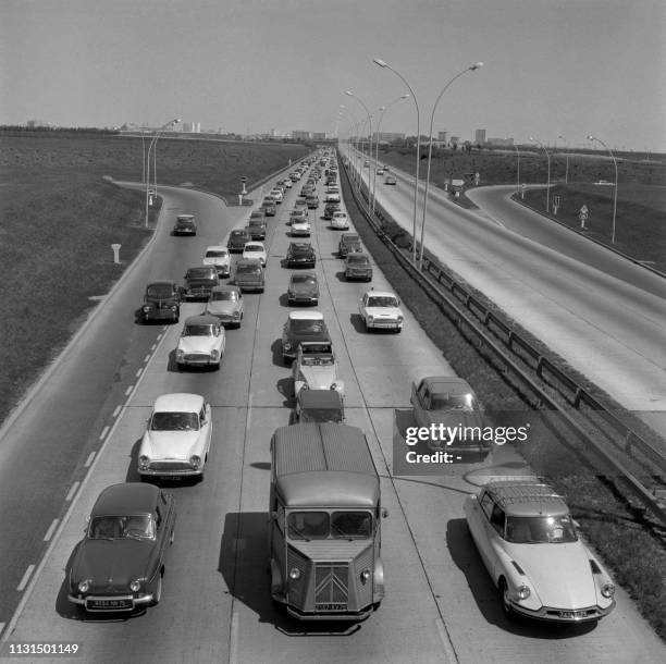 Traffic jam of hundreds of cars on route for holidays on the north-south motorway on May 17, 1964 near Paris. Cars foreground are Simca Aronde,...