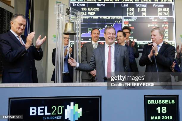 Tony De Pauw, WDP CEO Joost Uwents, Barco chairman Charles Beauduin and NYSE Euronext Brussels CEO Vincent Van Dessel pictured during the bell...