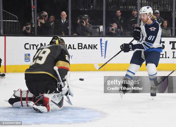 Kyle Connor of the Winnipeg Jets scores a first-period goal against Marc-Andre Fleury of the Vegas Golden Knights during their game at T-Mobile Arena...
