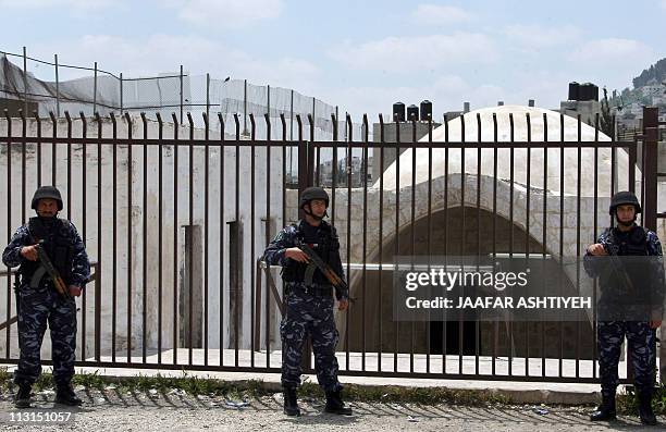 Palestinian police stand guard outside of Joseph's Tomb in the West Bank city of Nablus on April 25 a day after Palestinian policeman fired on a...