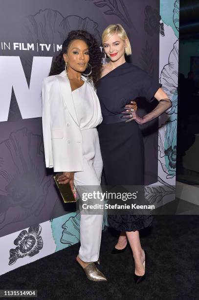 Angela Bassett and Jaime King, both wearing Max Mara attend the 12th Annual Women in Film Oscar Nominees Party Presented by Max Mara with additional...
