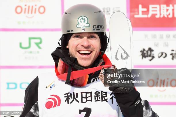 Bronze medalist Bradley Wilson of USA poses during the medal ceremony on day one of the Men's FIS Freestyle Skiing World Cup Tazawako on February 23,...