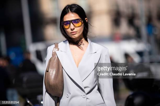 Doina Ciobanu, wearing Carrera sunglasses and grey jacket and pants, is seen outside Sportmax on Day 3 Milan Fashion Week Autumn/Winter 2019/20 on...