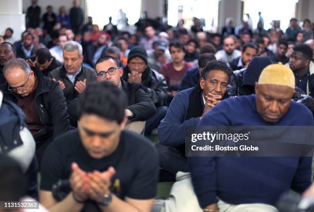 Worshippers attend a prayer service at the Islamic Society of Boston Cultural Center in the Roxbury neighborhood of Boston on March 15, 2019. Many...