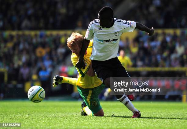 Zak Whitbread of Norwich City battles with Theo Robinson of Derby County during the npower Championship match between Norwich City and Derby County...