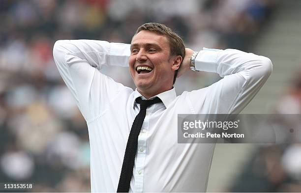 Huddersfield Town manager Lee Clark gives instructions to his players during the npower League One match between MK Dons and Huddersfield Town at...