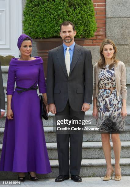 Sheikha Moza Bint Nasser Al-Missned, Prince Felipe of Spain and Princess Letizia of Spain pose for the photographers at El Pardo Palace on April 25,...