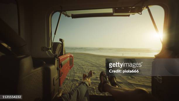 pov relaxing in a car by the sea in a road trip - pismo beach stock pictures, royalty-free photos & images