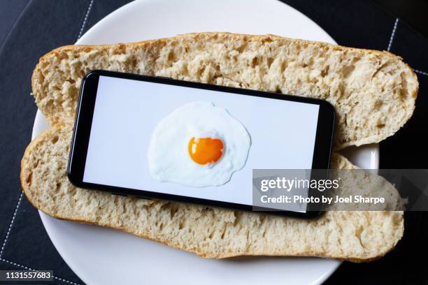 an egg on a phone on a baguette - augmented reality marketing stock pictures, royalty-free photos & images