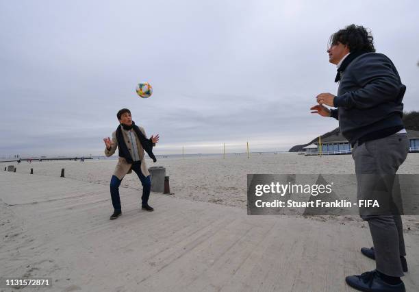 Legends Bebeto of Brazil and Fernando Couto of Portugal play with the official FIFA U-20 World Cup match ball on the beach prior to the official draw...