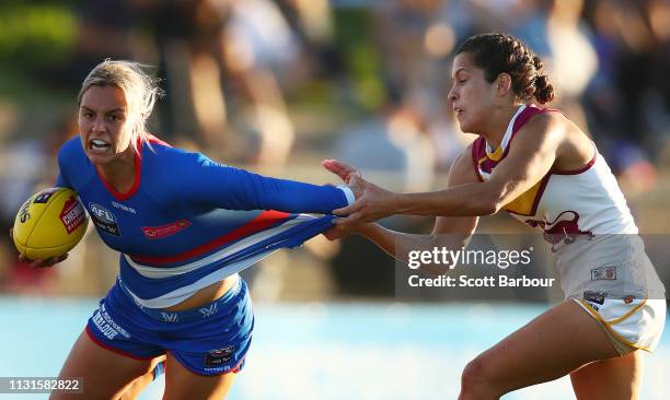 Deanna Berry of the Bulldogs is tackled by Ally Anderson of the Lions during the round 4 AFLW match between the Western Bulldogs and Brisbane Lions...